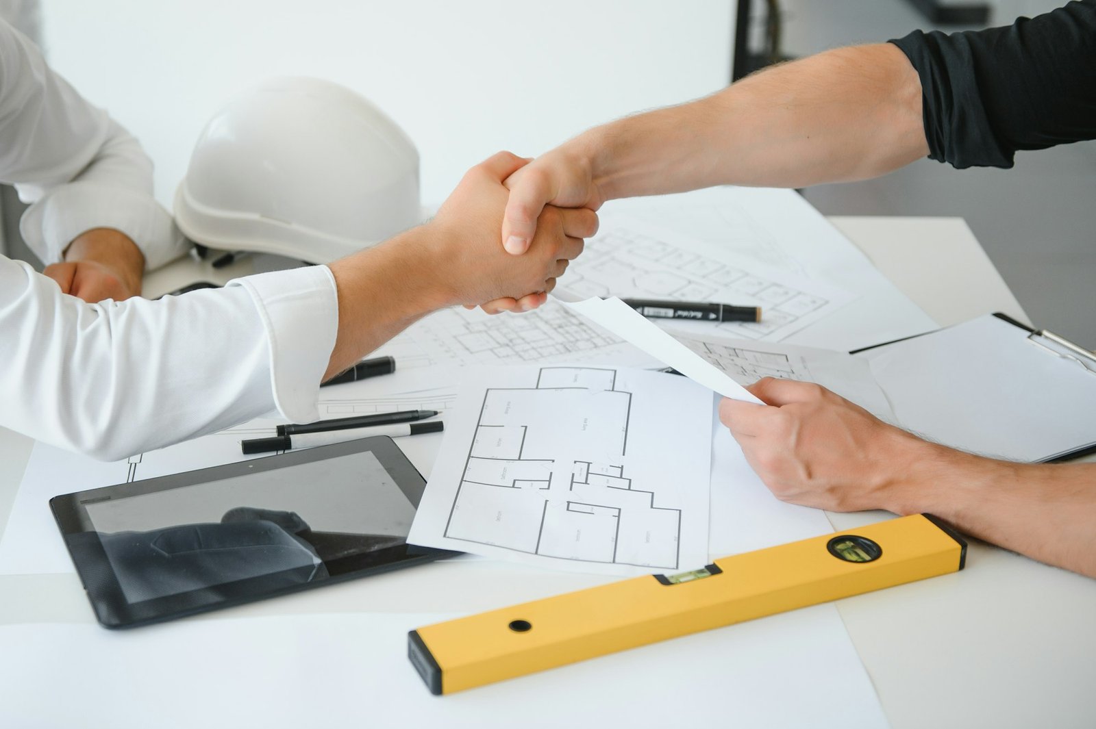Team of architects people in group on construciton site check documents and business workflow
